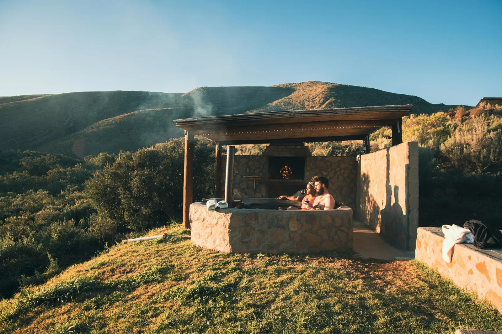 Aloeron’s private stone hot tub and built-in fireplace